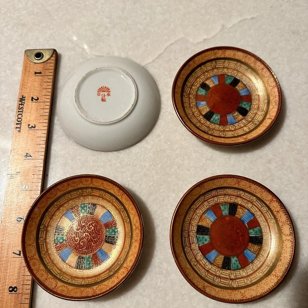 Vintage set of 4 small saucers. Hand painted 1000 faces